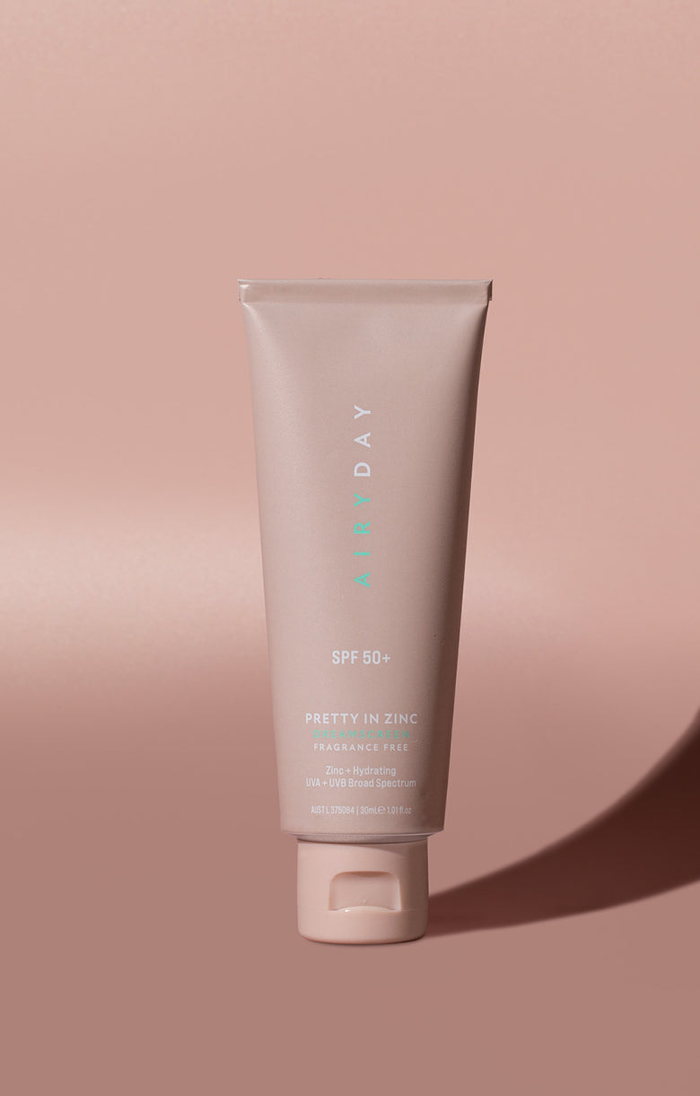 A tube of Pretty in Zinc SPF50+ Dreamscreen 30ml against a pink background.